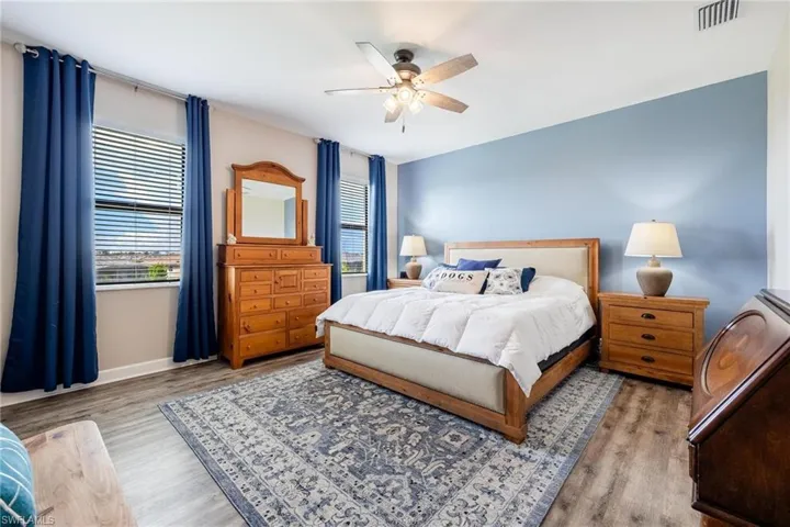 Bedroom featuring light wood-type flooring and ceiling fan