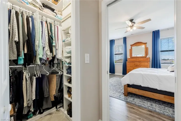 Bedroom featuring ceiling fan and light hardwood / wood-style floors