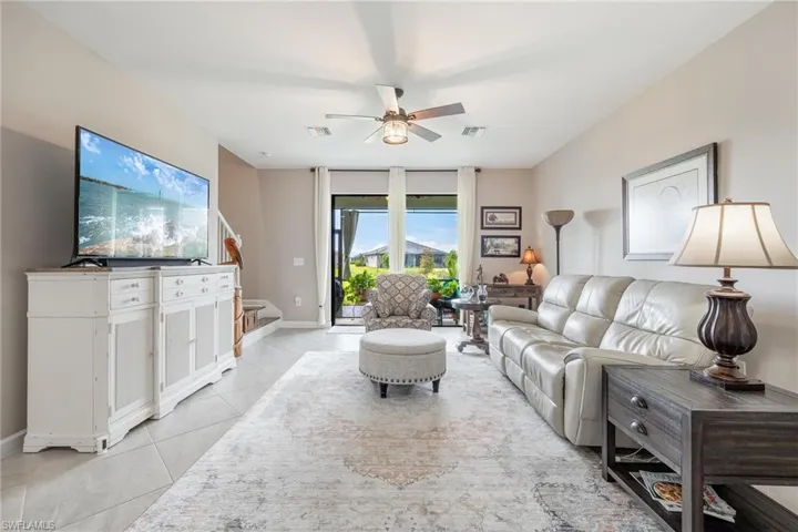 Tiled living room with ceiling fan
