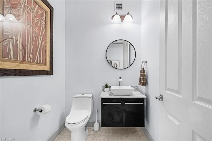 Bathroom featuring vanity and toilet