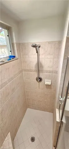 Full bath with a shower stall