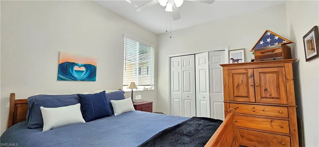 Bedroom featuring a closet and a ceiling fan