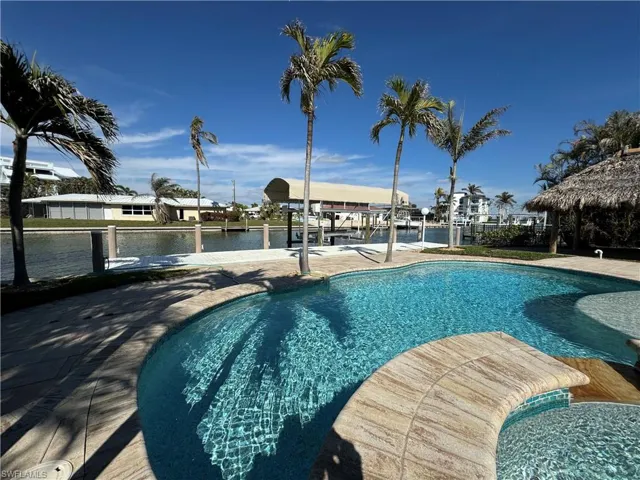 View of swimming pool featuring a water view