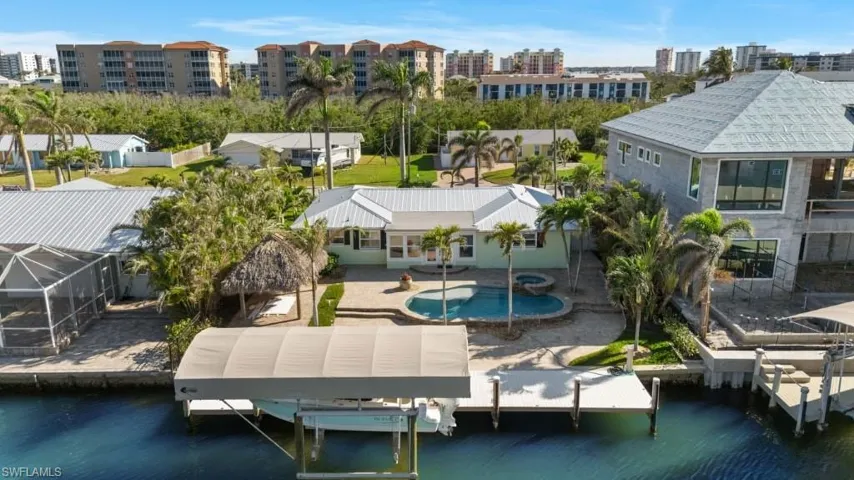 Aerial view featuring a water view - VIRTUALLY ENHANCED