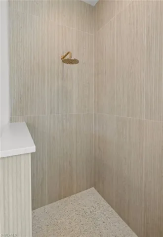 Bathroom featuring a tile shower