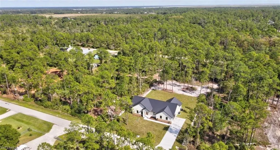 View from above of property featuring a forest