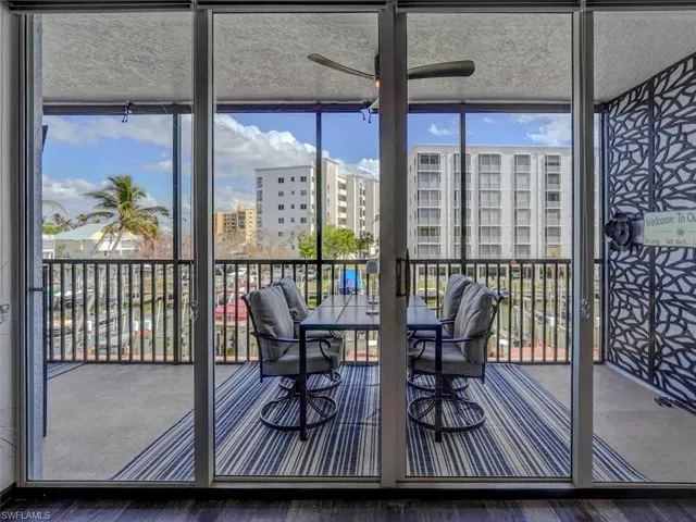VIEW FROM LIVING AREA OF SPACIOUS SCREENED LANAI WITH EASTERN CANAL VIEWS