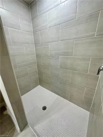 Bathroom featuring a shower stall