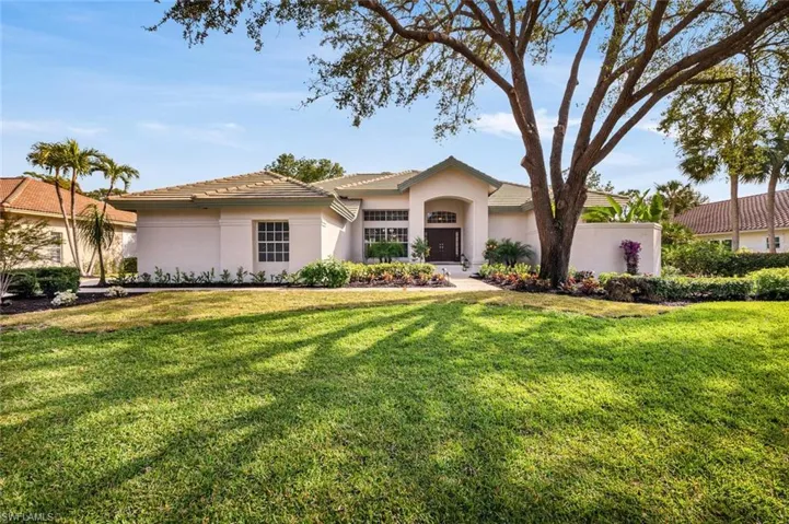 View of front of house with a front yard