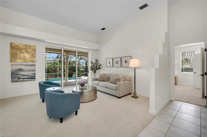 Living room featuring light carpet