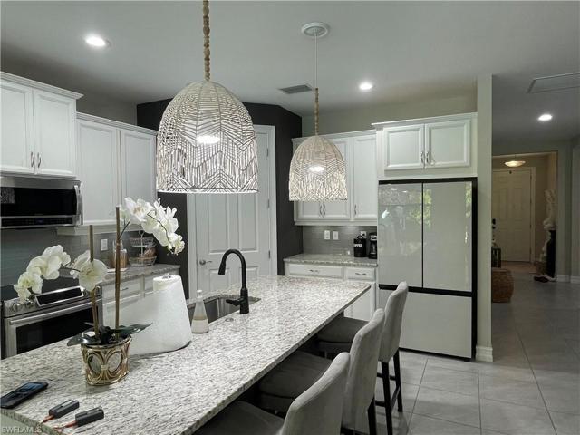 Kitchen w/ Glass Front Fridge