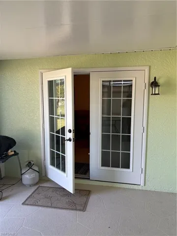 Property entrance with stucco siding