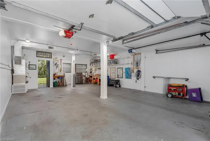 Large two-car garage.  Plenty of room for a workbench, etc.