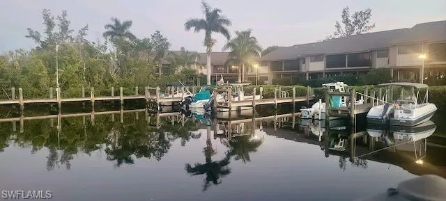 Dock area featuring a water view