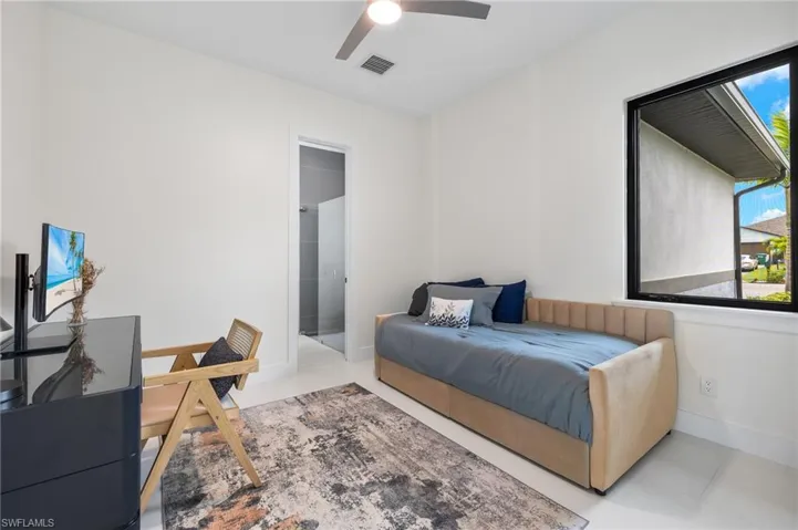 Bedroom 1 or Den/Office with ensuite bathroom and custom closet.