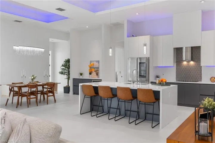 Spacious Kitchen with Flat Panel Soft Close Cabinets and Custom Cabinet Lights