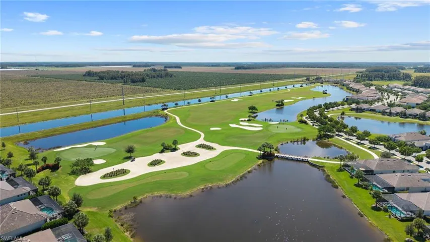 Expansive golf course and water features with mature landscaping