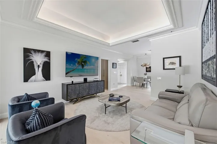 Sitting room accented by tray ceiling and up lighting