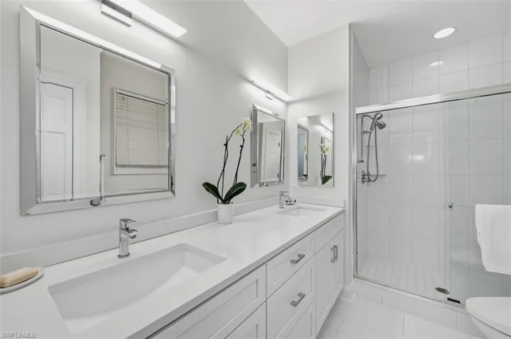 Primary bath accented by oversized shower & quartz counters