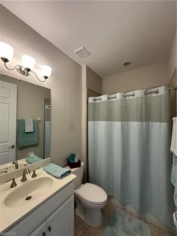 Hall bathroom between second + third bedroom
