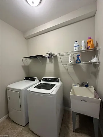 Laundry room featuring laundry tub