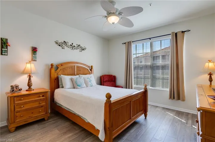 Bedroom with wood-type flooring and ceiling fan