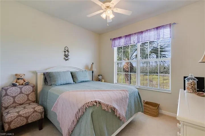 Bedroom featuring carpet and a ceiling fan