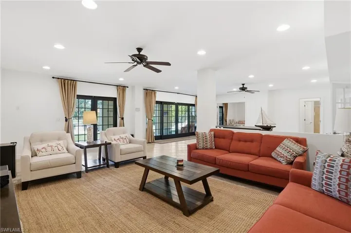 Living room featuring recessed lighting and ceiling fan