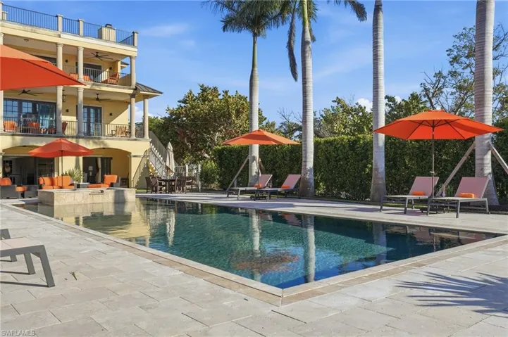 Swimming pool with a patio and stairway