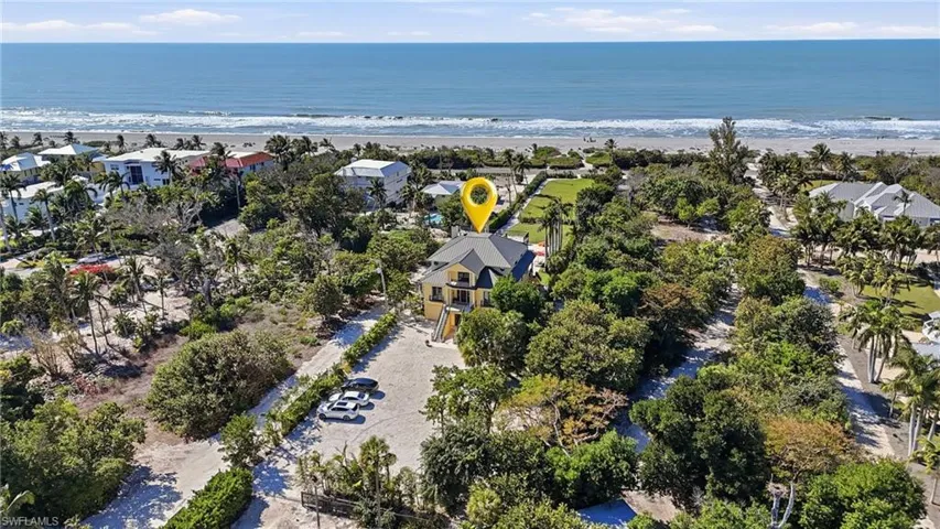 Aerial perspective of suburban area with extended coastline