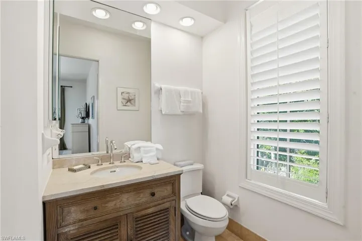 Bathroom with vanity and recessed lighting