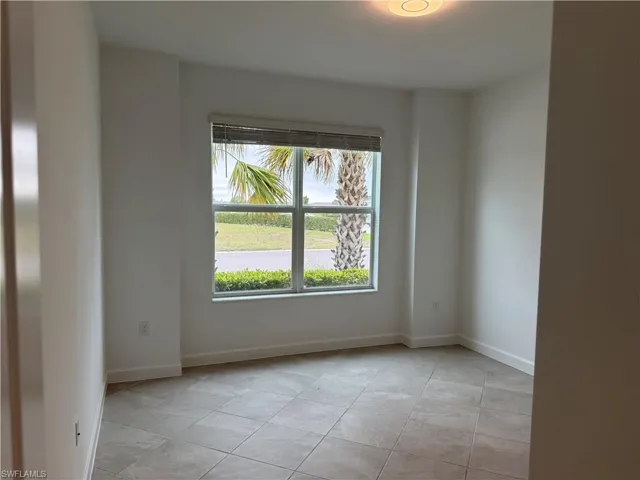 Bedroom 3 with light tile patterned flooring