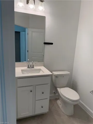 Full bath 1 featuring vanity and light tile patterned floors