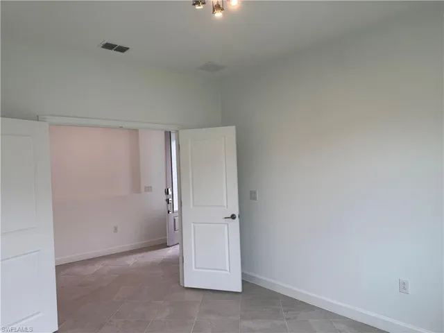 Unfurnished bedroom featuring baseboards