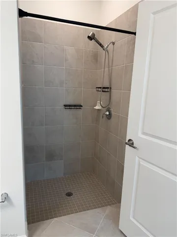 Bathroom 1 featuring a shower stall
