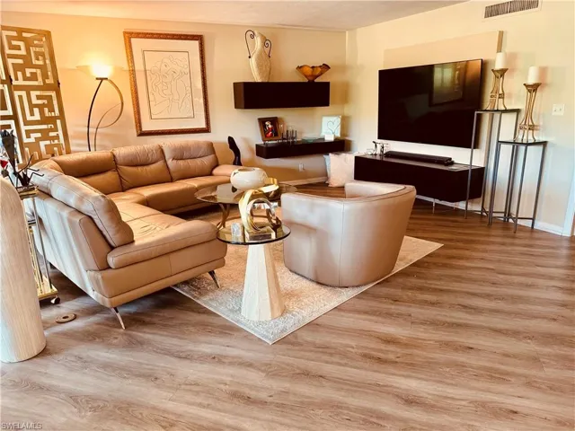 Living room with wood-type flooring