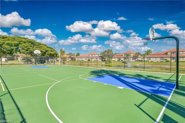 View of basketball court featuring community basketball court and a residential view