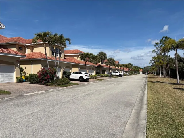 View of asphalt road featuring curbs