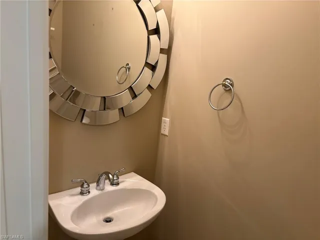 1/2 Bathroom featuring a sink and toilet