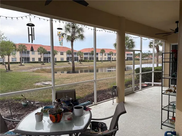 Sunroom with a water view