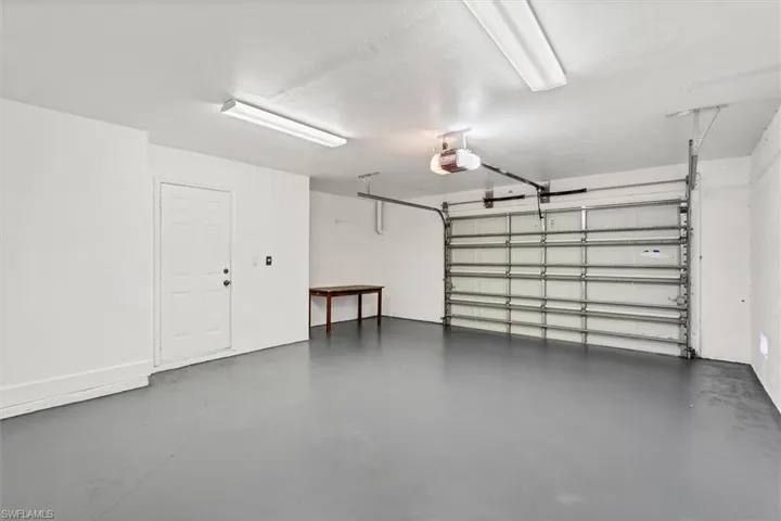 Garage featuring a garage door opener