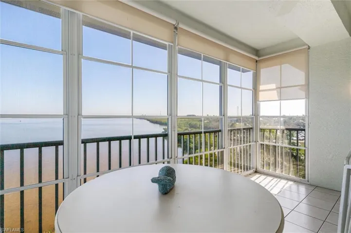All seasons lanai/sunroom featuring vast water views