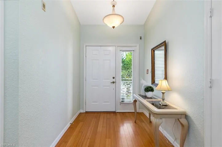 Foyer entrance featuring wood flooring