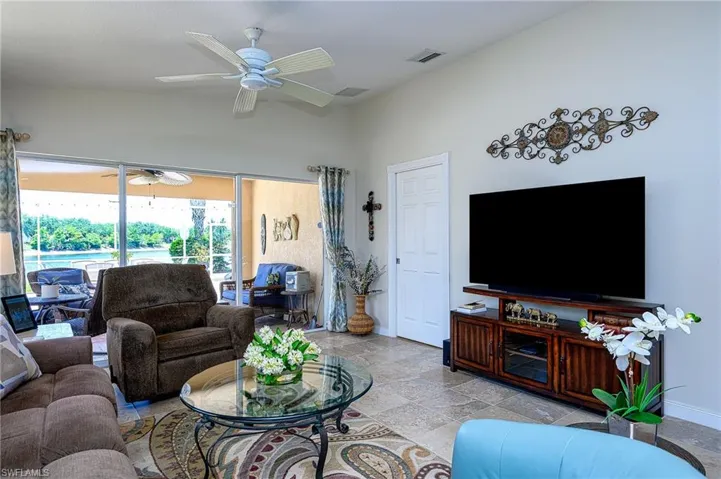 Tiled living room with ceiling fan
