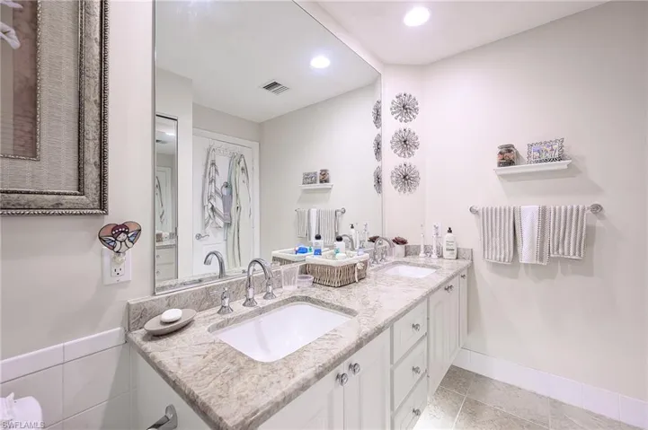 MASTER BATH WITH NEWER GRANITE TOP AND TWO SINKS