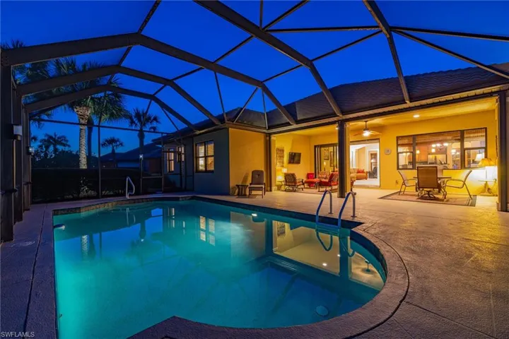 Pool featuring an outdoor dining & lounging space