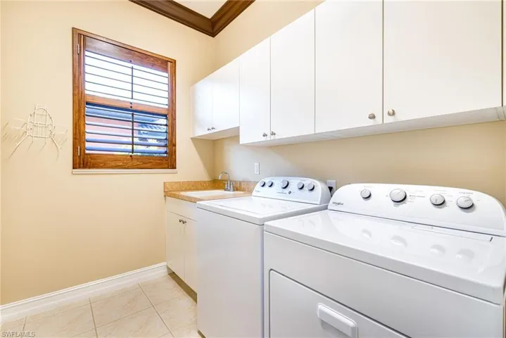 Laundry room with cabinets