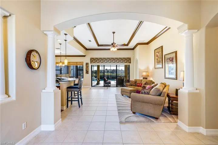 Welcoming foyer with ornate columns and arched walkways