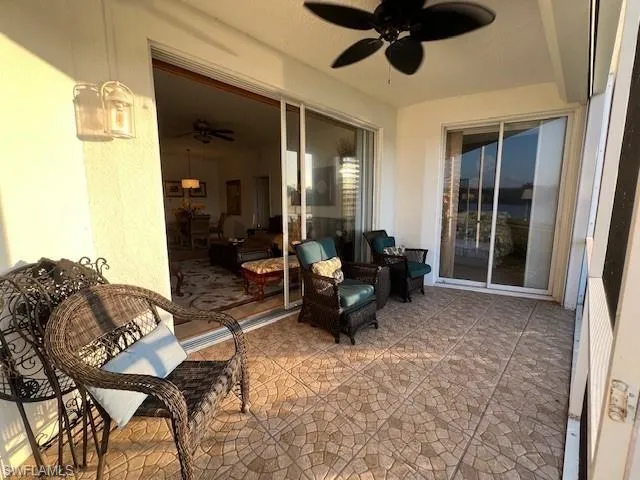 Screened Lanai with non-skid tile floor, ceiling fan & Electric Hurricane Shutters