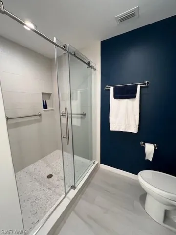 New tile plank floor,  walk-in shower & toilet